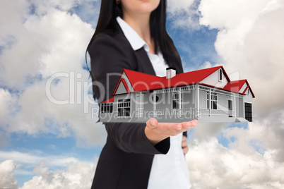 Composite image of pretty businesswoman presenting with hand