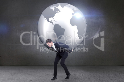 Composite image of businessman carrying the world