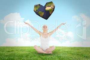 Composite image of toned young woman sitting with arms outstretc