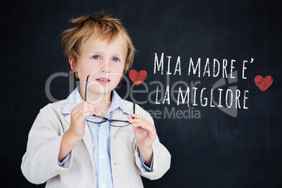 Composite image of cute pupil holding glasses