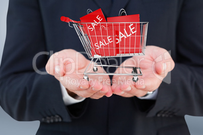 Composite image of close up of hand of a businessman