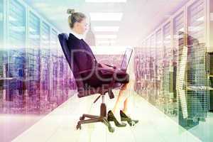 Composite image of businesswoman sitting on swivel chair with la