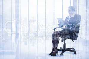 Composite image of businesswoman sitting on swivel chair with ta