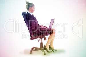 Composite image of businesswoman sitting on swivel chair with la