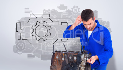 Composite image of confused mechanic repairing car engine