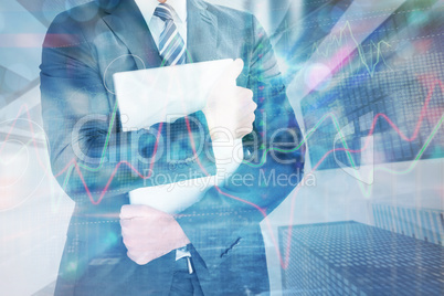 Composite image of businessman holding his laptop tightly