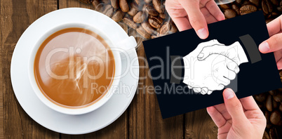 Composite image of hand showing card