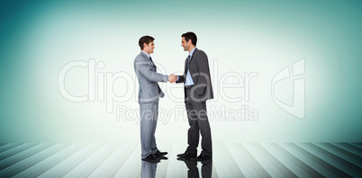 Composite image of businessmen shaking hands