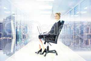 Composite image of businesswoman sitting on swivel chair with la