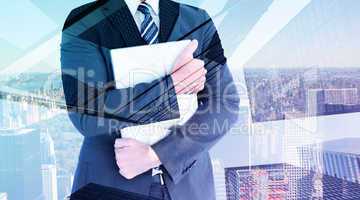 Composite image of businessman holding his laptop tightly