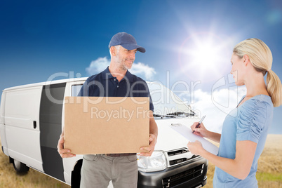 Composite image of happy blonde signing for a delivery