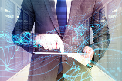 Composite image of businessman using his tablet pc