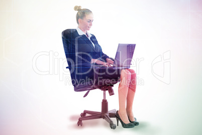 Composite image of businesswoman sitting on swivel chair with la