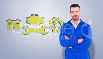 Composite image of mechanic standing arms crossed