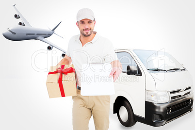 Composite image of delivery man giving clipboard for signature