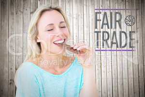 Composite image of pretty blonde enjoying and eating bar of choc