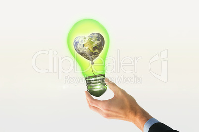 Composite image of businessman holding hand out in presentation