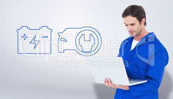 Composite image of mechanic using laptop over white background