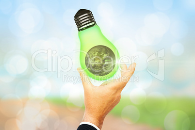 Composite image of businessman pointing with his finger