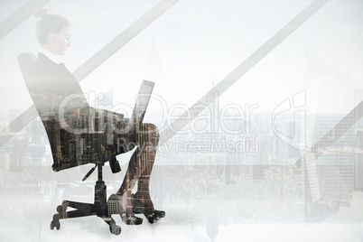 Composite image of businesswoman sitting on swivel chair with la