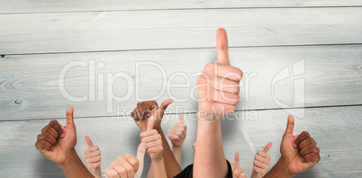 Composite image of hands showing thumbs up