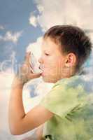 Composite image of boy using asthma inhaler in hospital