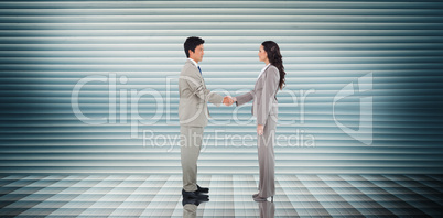 Composite image of business people shaking hands