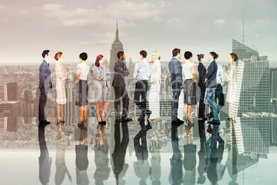 Composite image of many business people standing in a line