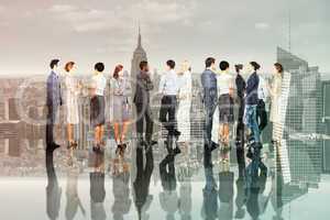 Composite image of many business people standing in a line