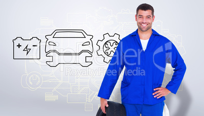 Composite image of smiling male mechanic holding tire