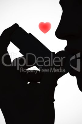 Composite image of blonde woman taking her inhaler