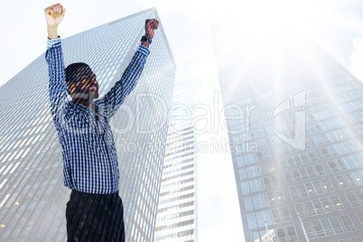 Composite image of excited businessman cheering