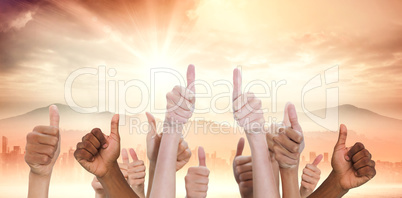 Composite image of hands showing thumbs up