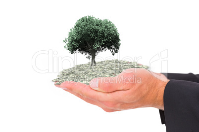 Composite image of businessman holding his hands out