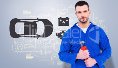 Composite image of smiling male mechanic holding monkey wrench