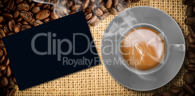 Composite image of yellow cup of coffee