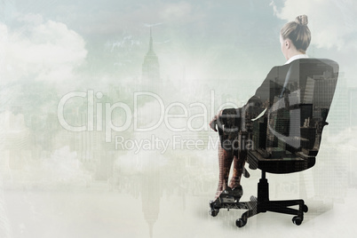 Composite image of businesswoman sitting on swivel chair in blac