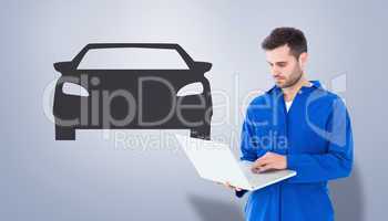 Composite image of male mechanic using laptop