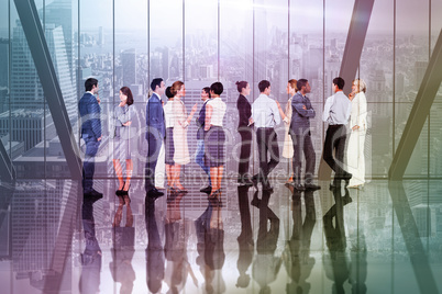 Composite image of many business people standing in a line