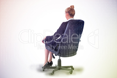 Composite image of businesswoman sitting on swivel chair in blac