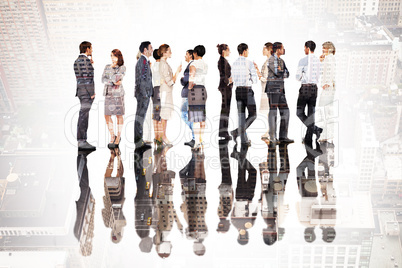 Composite image of many business people standing in a line