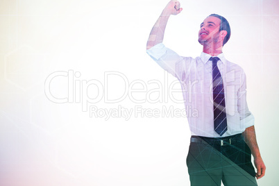 Composite image of businessman cheering with clenched fist