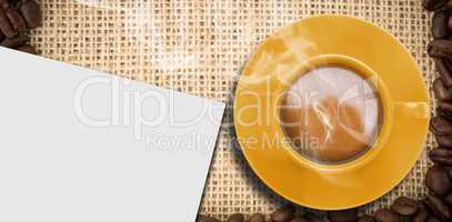 Composite image of yellow cup of coffee