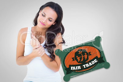 Composite image of pretty brunette eating bar of chocolate