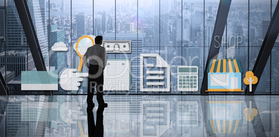 Composite image of businessman standing