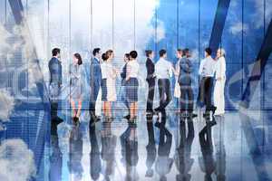 Composite image of many business people standing in a line