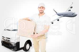 Composite image of delivery man carrying cardboard box