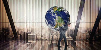 Composite image of businessman carrying the world