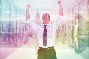 Composite image of handsome businessman cheering with arms up