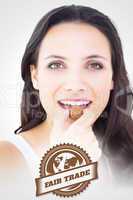 Composite image of pretty brunette eating chocolate candy